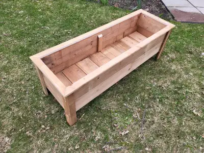 Large pressure treated planter box. Perfect for your garden. Ready for planting.