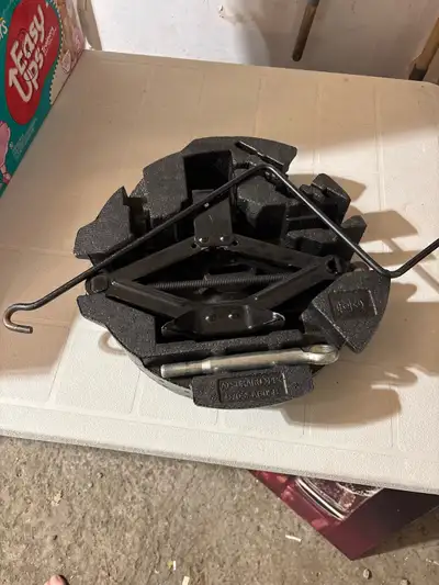 This Subaru SPT car tire jack is in used condition and ready to go! It comes with all the necessary...