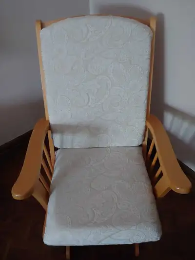 This is a comfy Glider Chair, perfect for a nursery or any room needing a cozy touch. The chair is i...