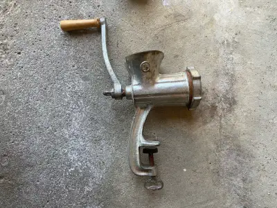 Here we have an antique meat grinder, a brace drill, a pair of pruning shears and a set of feeler ga...