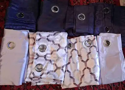 Add a stylish flair to any room with these decorative window curtains. This lot features an assortme...