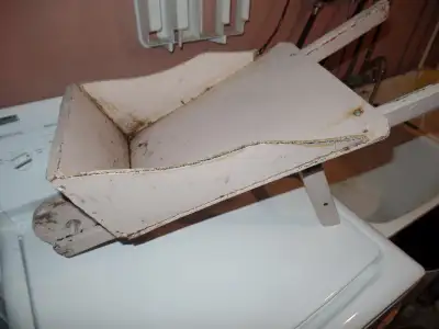 Small wooden wheel barrow for garden decoration for sale. It is very nice, could use a new coat of p...