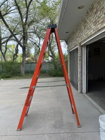 8 foot Featherlite step ladder. Nonslip rubber feet. Slip resistant 3" steps. Reinforced edge bracin...