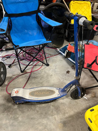 Electric scooter with kick stand and charging cord