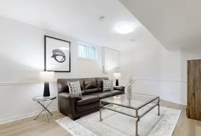 Beautifully renovated 1600+ sqft basement with newly installed hardwood floors, bathroom, open kitch...