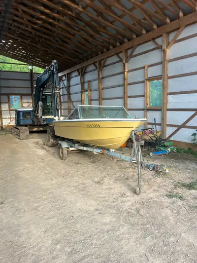 Older boat probably 70s, around 15 feet long, boat is in good shape and has good transom, comes on a...