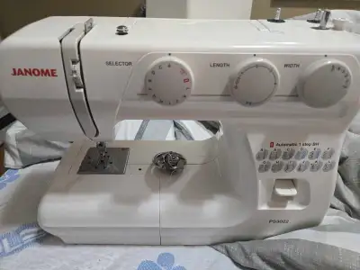 This is a Janome PS3022 sewing machine, featuring multiple stitch patterns and automatic buttonholer...