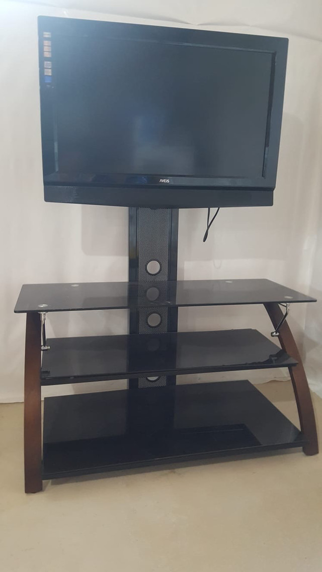 Tv stand with free Tv with it in TV Tables & Entertainment Units in Winnipeg