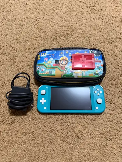 Selling a working Nintendo Switch Lite (Turquoise) with Minecraft pre-installed. Includes charger, 6...