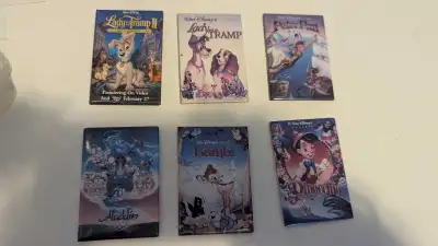 Relive the magic of Disney with this collection of movie magnets and pin featuring beloved classics...