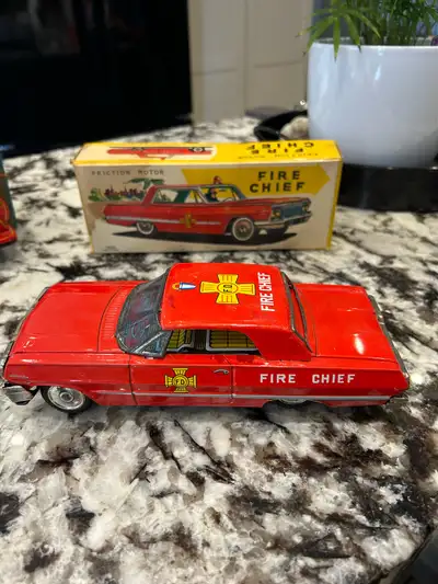 Vintage metal 1950’s made in Japan fire chief car and fire truck with firefighter in very good condi...