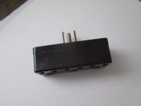 black 3 prong plug with 3 extra 3 prong  outlets.