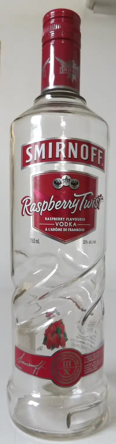 This is an original vintage Smirnoff Raspberry Twist glass bottle. The bottle measures 12" tall by 3...