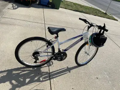 Mountain bike + helmet + hand pump For younger. Bike under warranty. Like new condition. No damage....