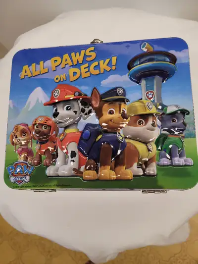 “All Paws On Deck” Paw Patrol Metal Lunch or Storage Box Graphics on both sides of tin Featuring cha...