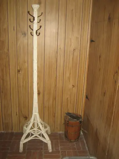Lovely decorative antique wicker coat / hat stand with 4 brass hooks. Measures 71 3/4" high, 17" wid...
