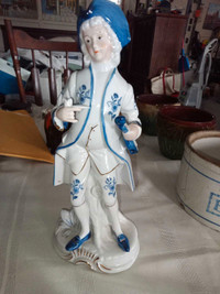 10 3/4 in. High porcelain figurine, violin, blue hat.