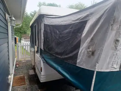 1997 coleman sante fe ppp ip camper for sale. Needs safety inspection. Tears in canvas due to squirr...