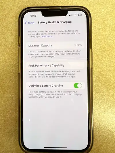 iPhone 13 product red. 100% battery life, View more