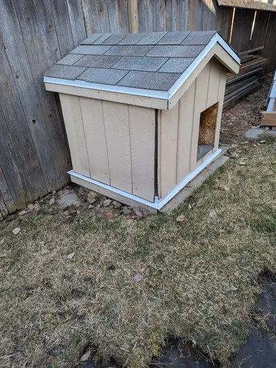 Insulated doghouse for a medium size dog. Asphalt shingle roof and Smart board panel exterior, built...