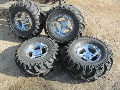 27x9x12 front 27x12x12 rear Carlisle mud tires on aluminum rims 4 on 110 bolt circle. in good shape...