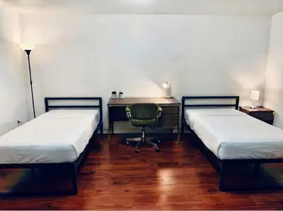 Two beds are available in a large shared basement bedroom in a quiet, clean home. Unlike many shared...