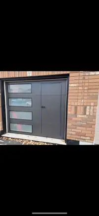 Garage door with man door