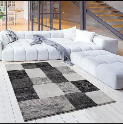Rug features a geometric design with varying, View more