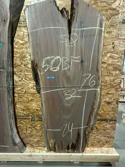 Beautiful live edge black walnut slab with incredible grain movement and natural edges—perfect for a...
