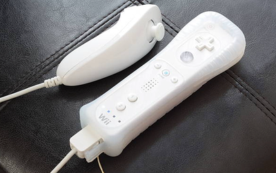 Official Nintendo Wii Mote Controller with a Nun Chuck 1x Set = $35 2x Set = $65 3x Set = $90
