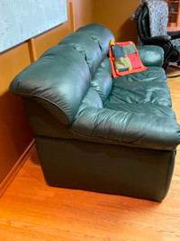 2 dark green leather sofas