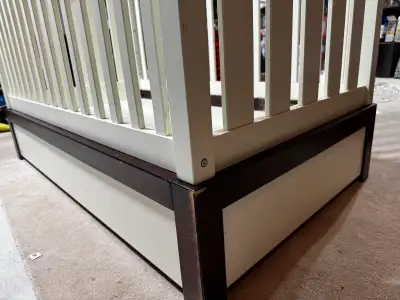 Solid wood baby crib with storage. Minor scratches from moving but in great condition. Priced for qu...