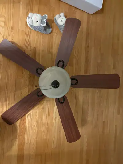 Add a touch of elegance to any room with this used, six-blade ceiling fan, featuring a marbled glass...