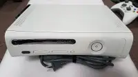 Xbox 360 in near new condition with games