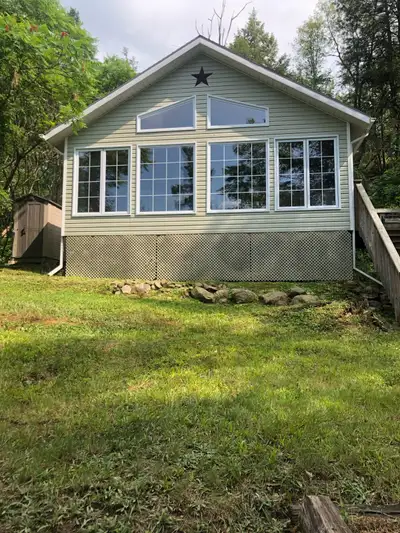 24X24 4 season cottage. It is on an island. Bobs Lake. 1 minute boat ride from marina. Compost toile...