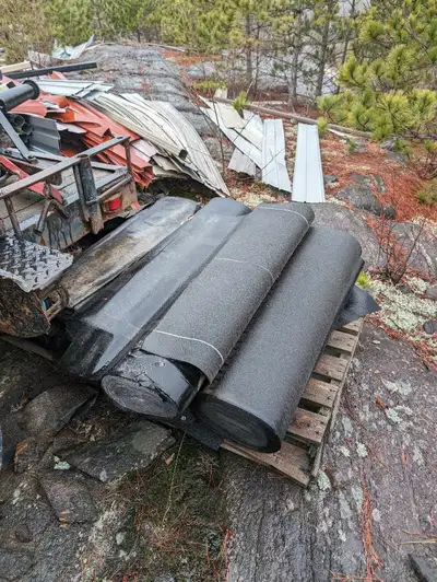 Several rolls of roofing felt / tar paper & 100lb felt .20 each Roof vents in green ,& exhaust vents...