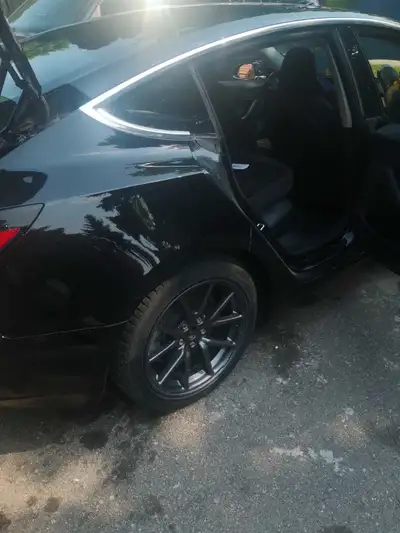 I am selling my 2019 Tesla Model 3 Standard Plus, an all-electric sedan with 55,361 kilometers, blac...