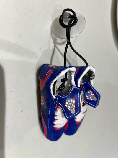 Show your team pride with these miniature Croatian soccer shoe hanging ornaments, perfect for displa...