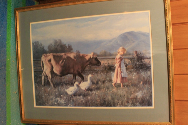 LARGED FRAMED PRINT OF YOUNG GIRL AND COW, GOOD CONDITON, in Arts & Collectibles in Thunder Bay