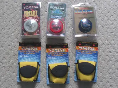 Three new vintage yo-yos along with three holsters. Fireball, Saber Brain, and Black Mamba yo-yos as...