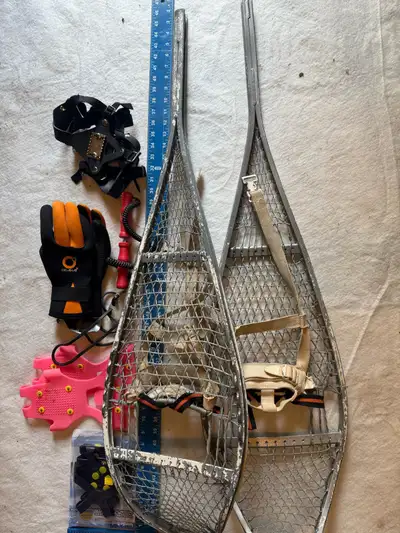 A set of snow shoes and other winter items , View more