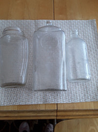 Three very old glass bottles