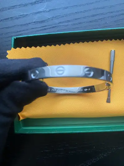 This is a used Cartier bracelet, in excellent condition. This stylish bracelet features the iconic C...