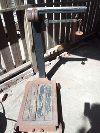 Antique platform scale with original weights included