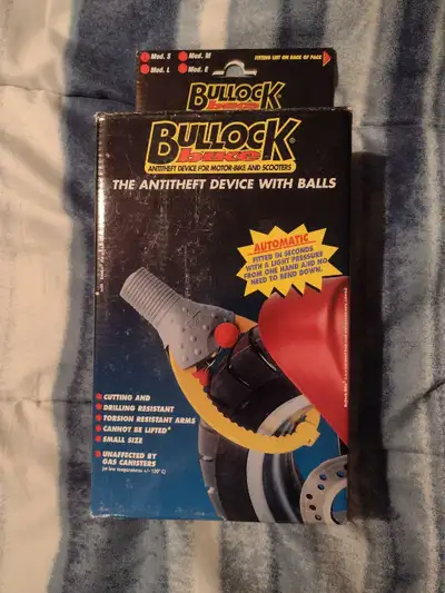 New in box Bullock motorcycle and scooter/ebike antitheft wheel lock with 2 keys and rubber carry po...