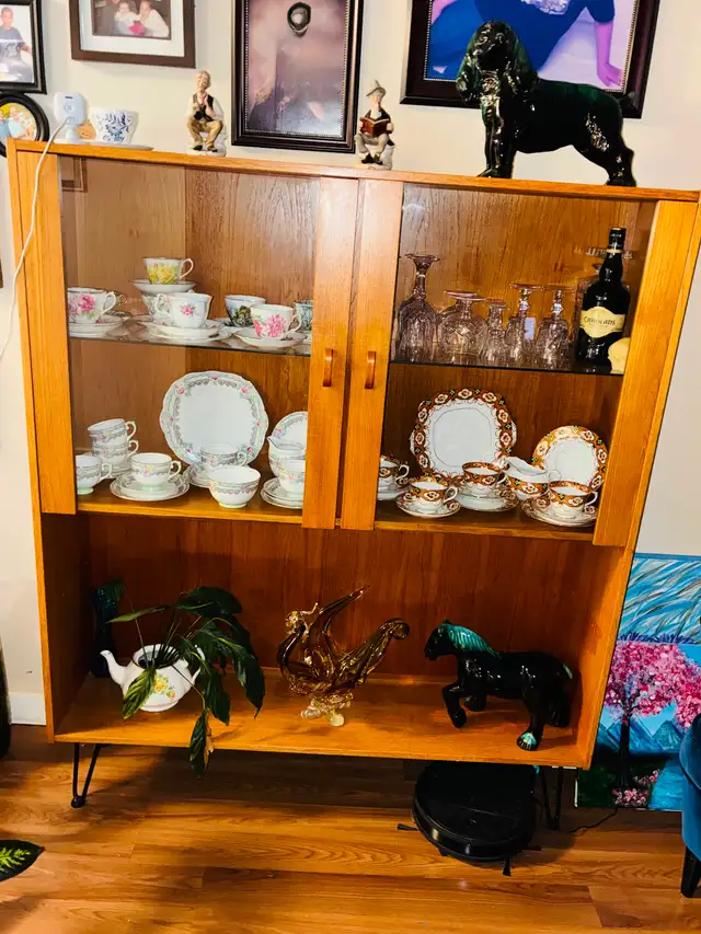 Mid-century teak wood cabinet with glass shelves and glass doors