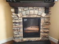 Electric stone look fireplace and mantel