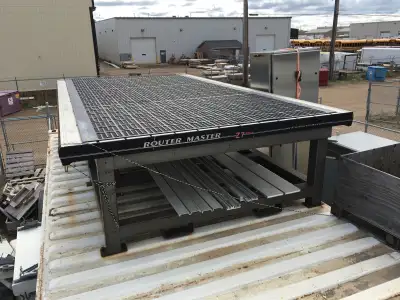 4x4 welded, powder coated steel frame with aluminum vacuum table. Formerly from a CNC router. Aprox...