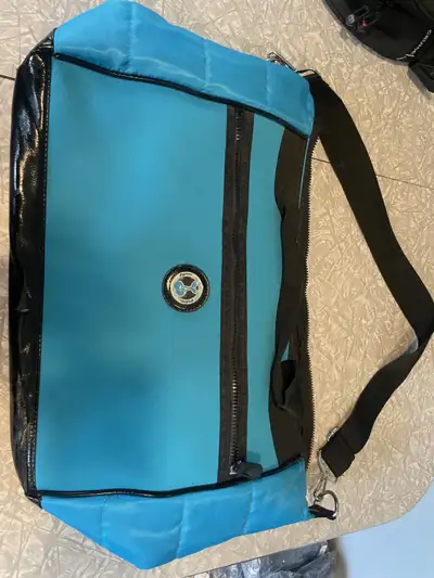 This yoga bag is huge and has a place on the side to slide your yoga mat into. It is 16 X 7 X 14 inc...