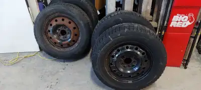 215/65 R16. 4 tires and rims. 2 tire are 1 season old 2 need to be replaced. 5x115 bolt pattern rims...